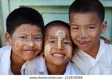 YANGON - MYANMAR - DECEMBER 3, 2013: Unidentified Burmese boys on December 3, 2013 in Yangon, Myanmar. In 2012 an ongoing conflict started between Buddhists and Muslims in Myanmar.