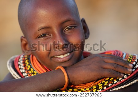 ARCHERS POST - KENYA - JANUARY 16, 2015: Unidentified young Samburu girl  with ochre on January 16, 2015 in Archers Post, Kenya.