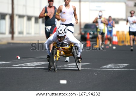 LANZAROTE , SPAIN - NOVEMBER 29: Disabled athlete in a sport wheelchair during 2009 Lanzarote marathon on November 29, 2009 in Lanzarote, Spain.
