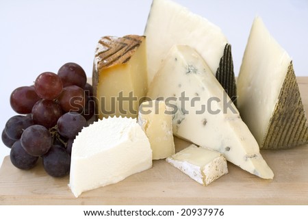 An assortment of cheeses on a cheese-board