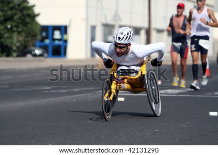 LANZAROTE , SPAIN - NOVEMBER 29: Disabled athlete in a sport wheelchair during 2009 Lanzarote marathon on November 29, 2009 in Lanzarote, Spain.