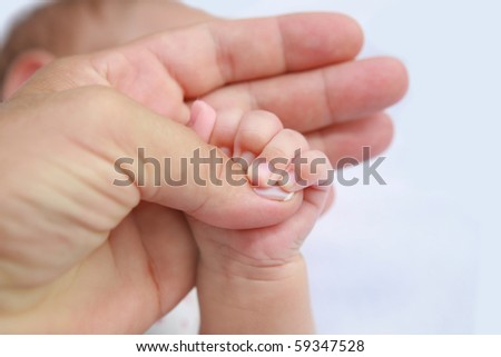 Mother's and baby's hands