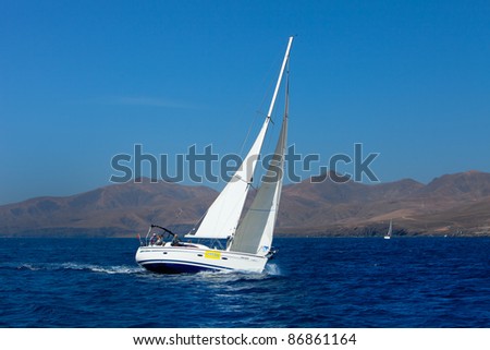 LANZAROTE, SPAIN - OCT. 12: One fully crewed yacht with No. 3 sails with white sails in the Russian BOSS Regatta, Oct. 12 2011, Canary islands, Spain