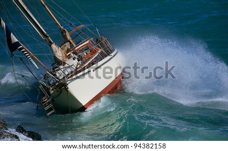 yacht crash on the rocks in stormy weather