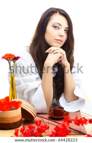 beautiful woman  in cafe over white background with red  flowers