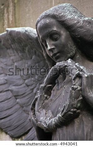 Angel. Close-up from an old Belgian statue.