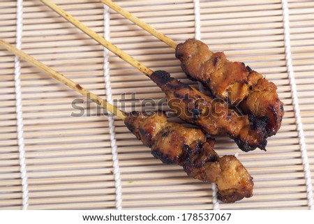 Asian food - Chicken Satay on bamboo mat