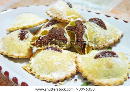 Typical Sicilian Mpanatigghi cakes, made during Easter holidays in the area of Modica and filled with chocolate and fine mice