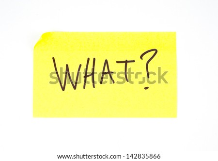 \'What?\' written on a yellow sticky note