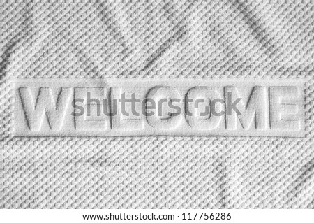 White welcome mat made from fabric