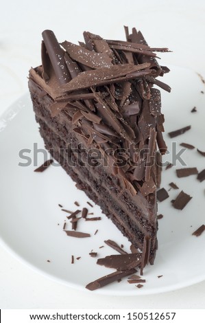 Piece of chocolate cake with chocolate flake topping