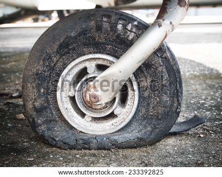 Old rusty dusty flat tire.