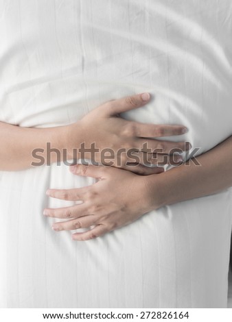 Woman hand hugging white pillow