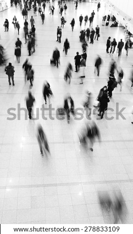 Crowd of commuters in motion blur