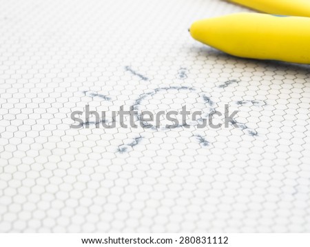 Doodle sun on magnetic drawing board