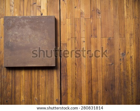 Metal plate on wood plank background