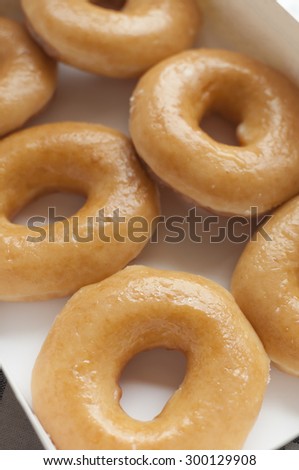 Glazed donuts in box