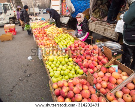 Dalian, China - January 18, 2015 : Street fruit seller on street market in China.