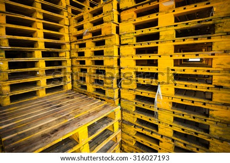 Old grunge yellow wood pallets background.