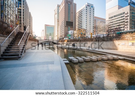 Seoul, South Korea - February 27, 2015: People at Cheonggyecheon stream. The stream is a 10.9 km long, modern public recreation space in Seoul downtown.
