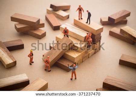 Worker making wood step stair. Success building concept.