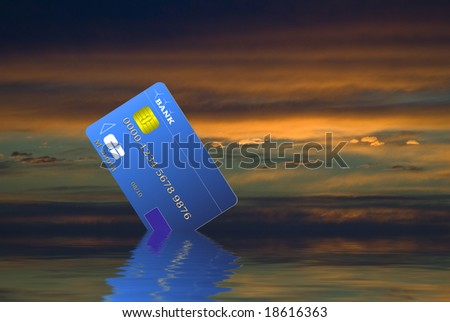 Credit card sinking with the economy during recession - Computer illustration