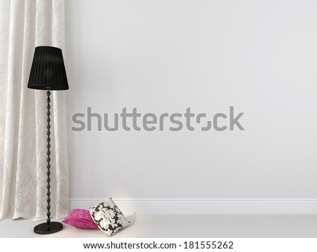 Elegant black floor lamp and colored pillows against a white wall and curtains