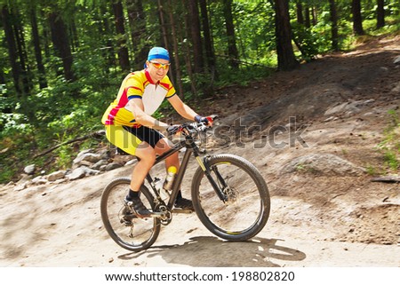 young male riding a mountain bike outdoor