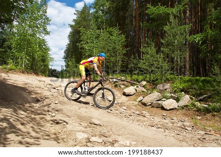 young male riding a mountain bike outdoor. mountain bike