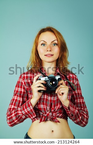young woman with a camera. old photo camera. youth lifestyle