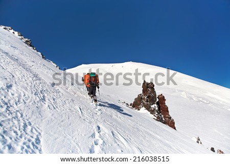 Group of hikers in the mountain. Climb to the top. mountaineering