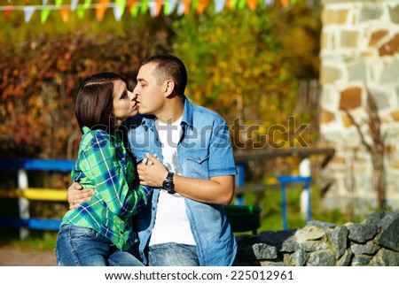loving couple on a walk in the park in spring or autumn. people outdoor