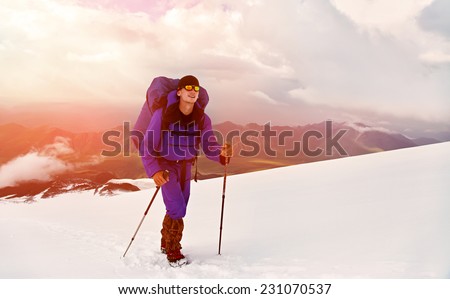 hiker in the mountain. Climb to the top. summer hiking