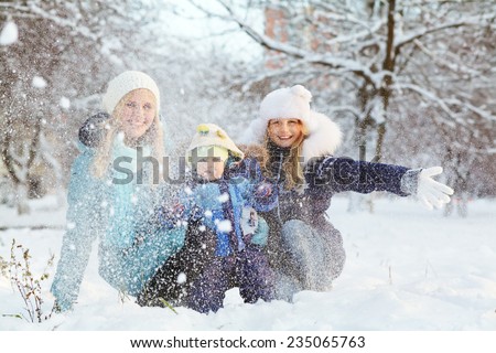 happy family in winter park. people outdoors. funny mommy with her children