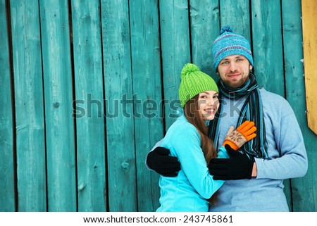 Young happy couple in love outdoors in the winter