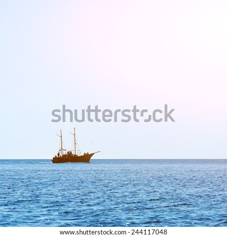 sailing ship the high seas on the horizon in good weather on a background of blue sky. marine background. marine tourism