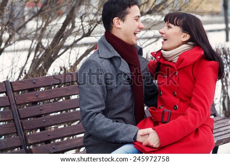 Young happy couple in love outdoors. loving man and woman on a walk in the city