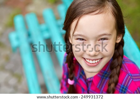 portrait of a beautiful teenage girl in a summer park. youth lifestyle