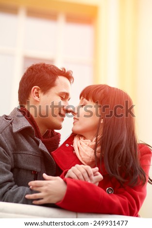 Young happy couple in love outdoors. loving man and woman on a walk in the city