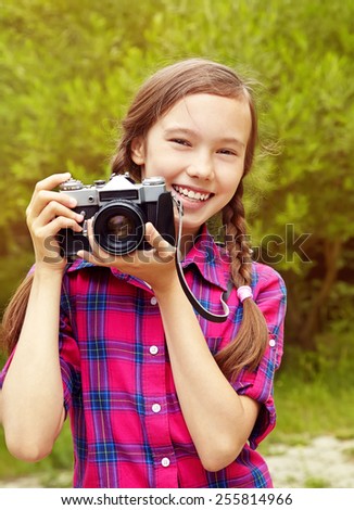 teenage girl with a retro camera. old photo camera. youth lifestyle