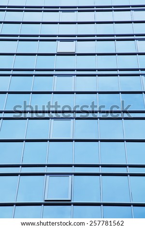 windows of office buildings. view of business center outside. rhythmic cityscape background