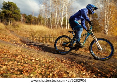 man riding a mountain bike outdoor. extreme sport