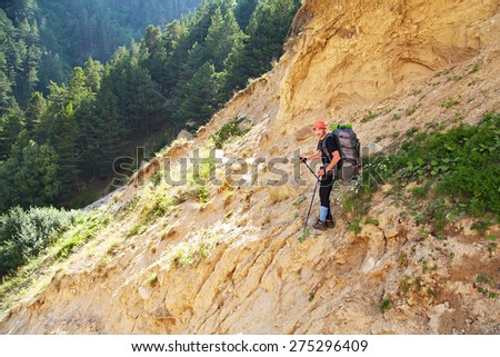 trail in the mountains. a hiker in the mountain. Climb to the top. mountaineering
