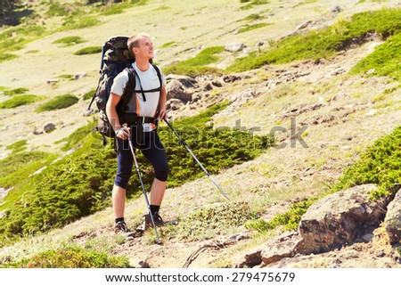 trail in the mountains. a hiker in the mountain. Climb to the top. mountaineering