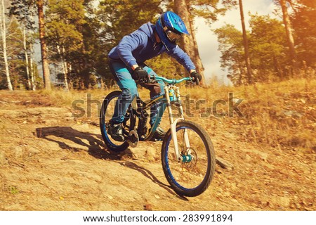 man riding a mountain bike outdoor. extreme sport