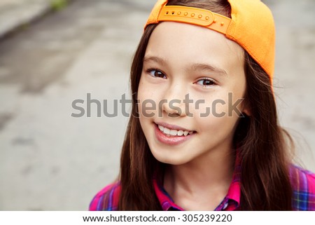 Beautiful teenage girl outdoors. youth lifestyle. portrait of adolescent in the city