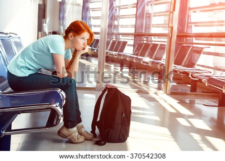 woman at the airport. waiting hall. flight delay