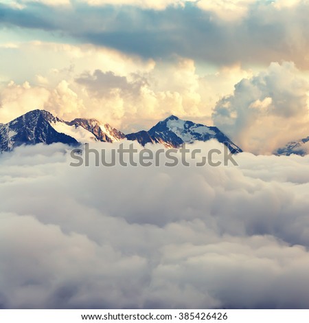 scenic alpine landscape with mountain ranges. natural mountain background. vintage stylization