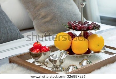 closed up fruits on wooden tray in bed at the hotel