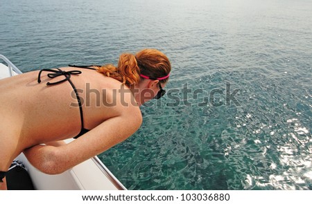 Woman experiencing motion sickness while on a boat